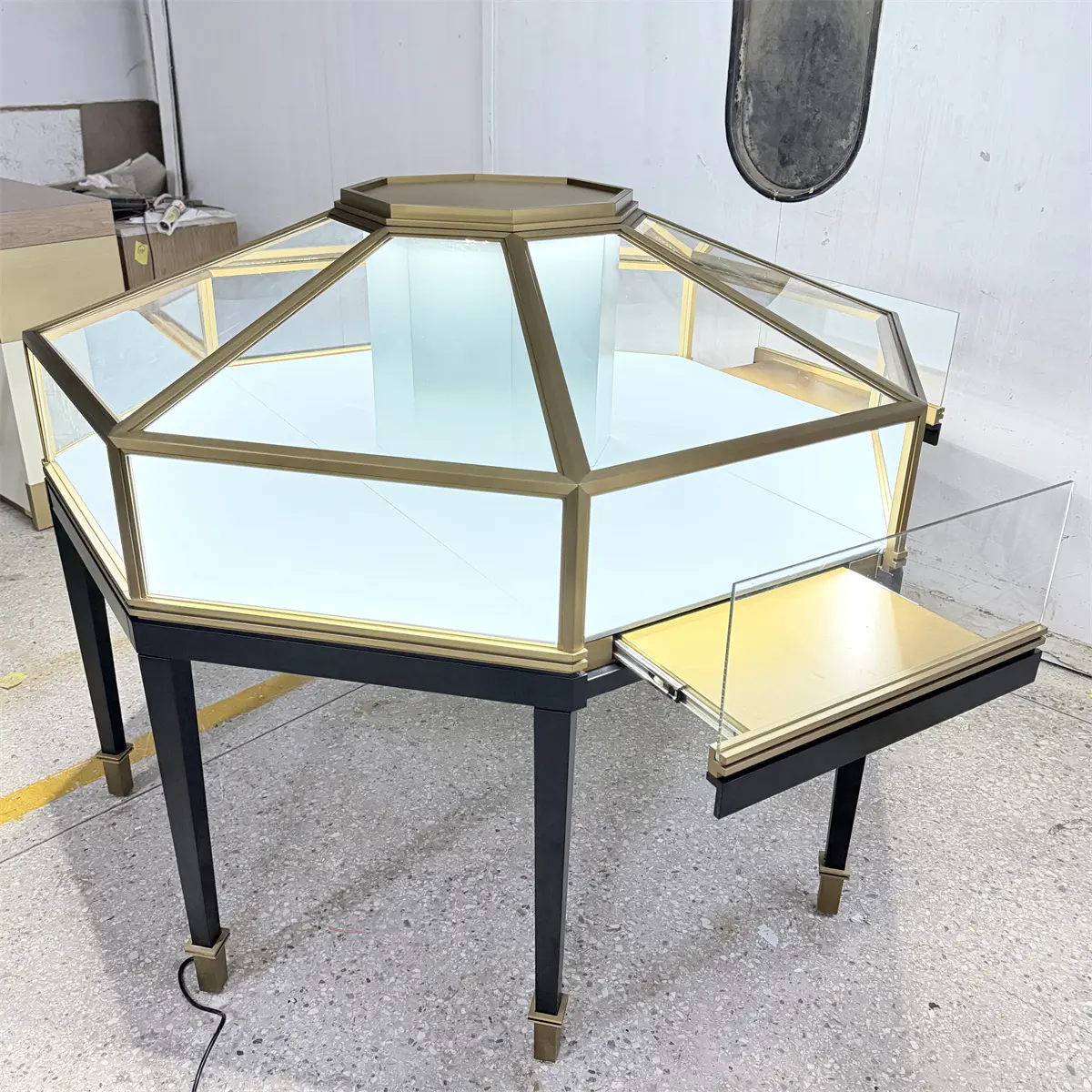 Custom Octagonal Jewelry Showcases featuring a smooth sliding pull-out drawer for easy retail access.